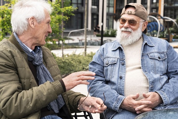 two-older-men-city-chatting-together