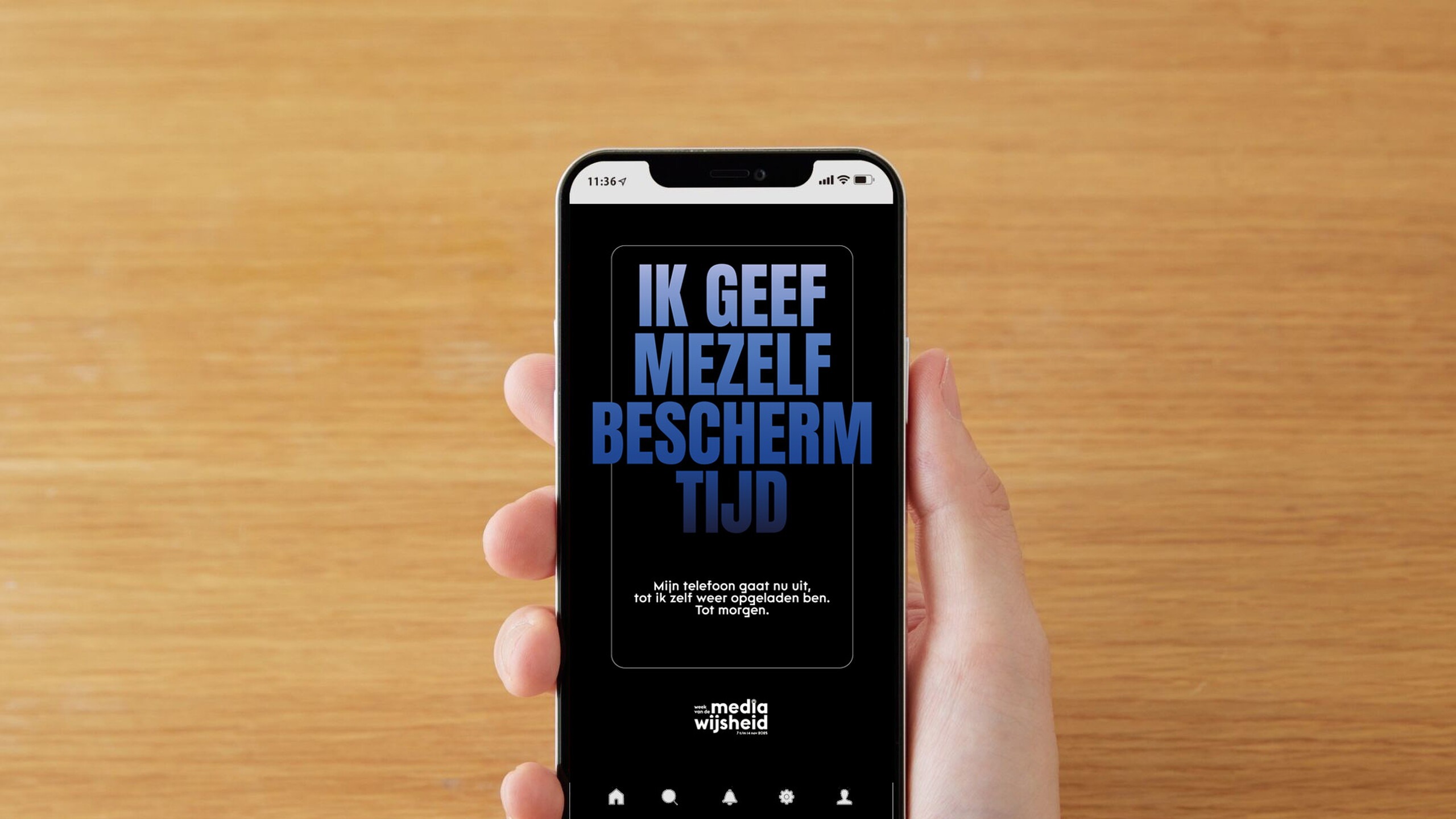 Mobiele telefoon met daarop een afbeelding met de tekst 'Ik geef mezelf beschermtijd'